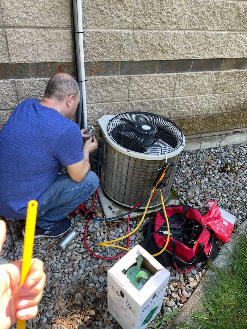 Our technician working on an outdoor AC unit