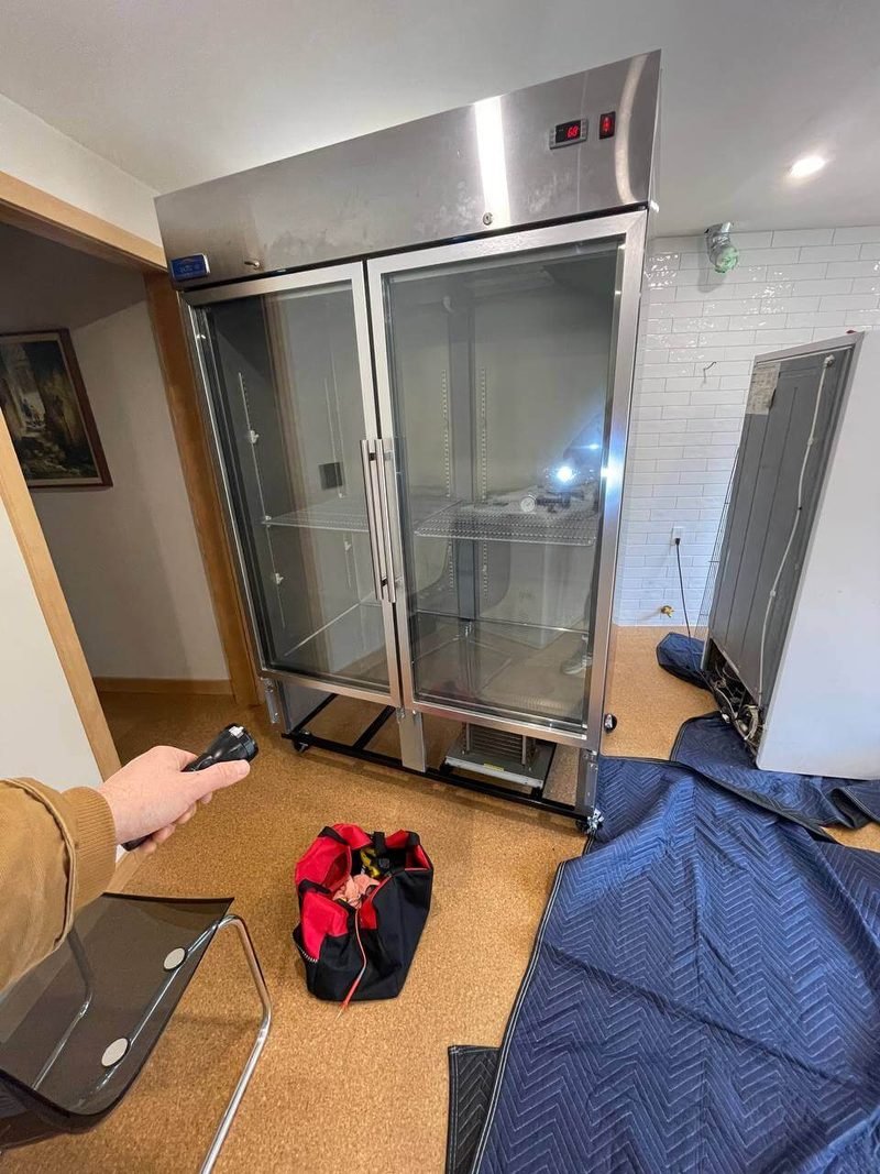 Two-door commercial reach-in refrigerator on a service call