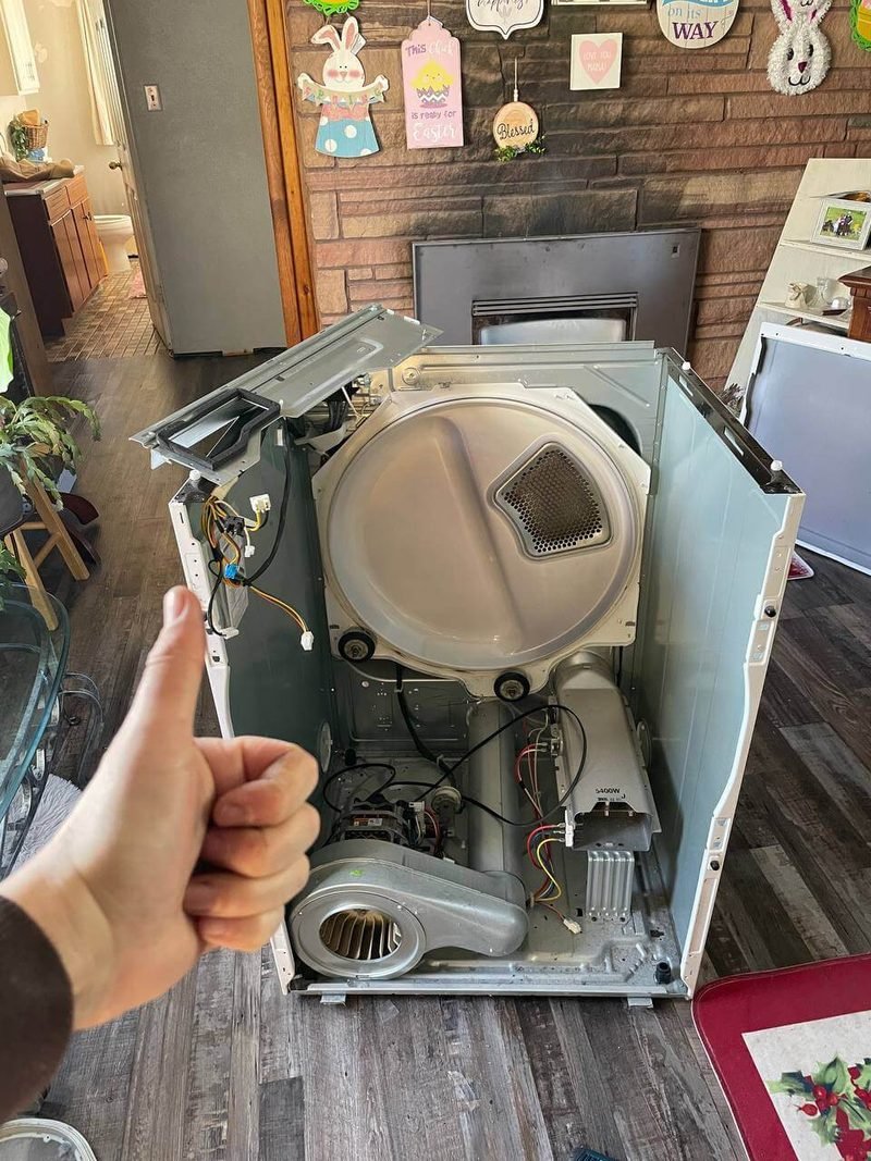 Dryer opened up with the drum and blower exposed