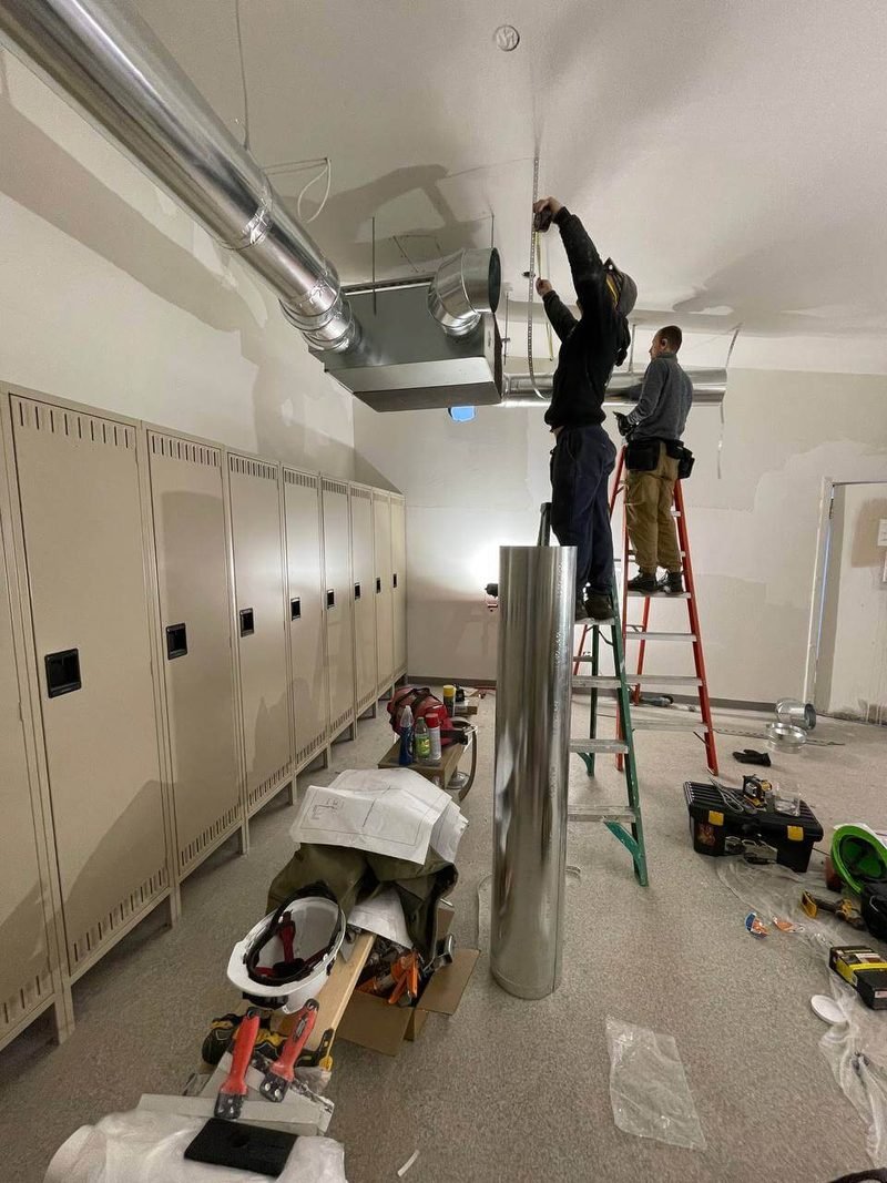 Our crew installing ductwork on a commercial job