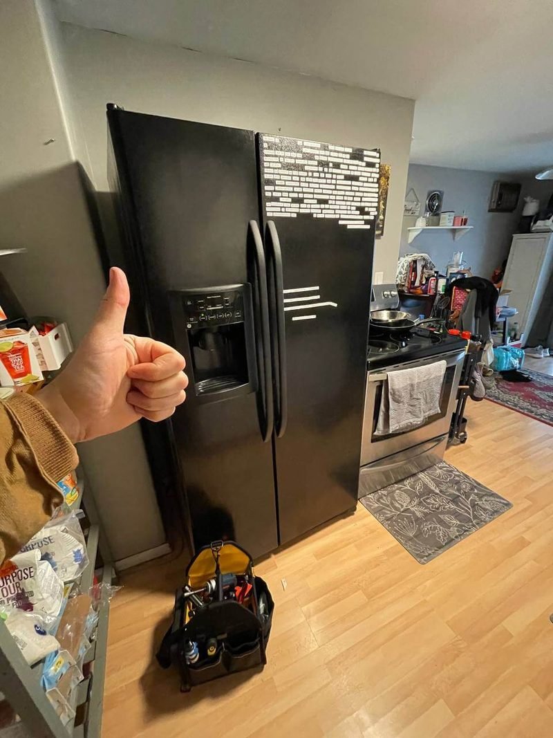 Side-by-side refrigerator with our tool bag on a service call