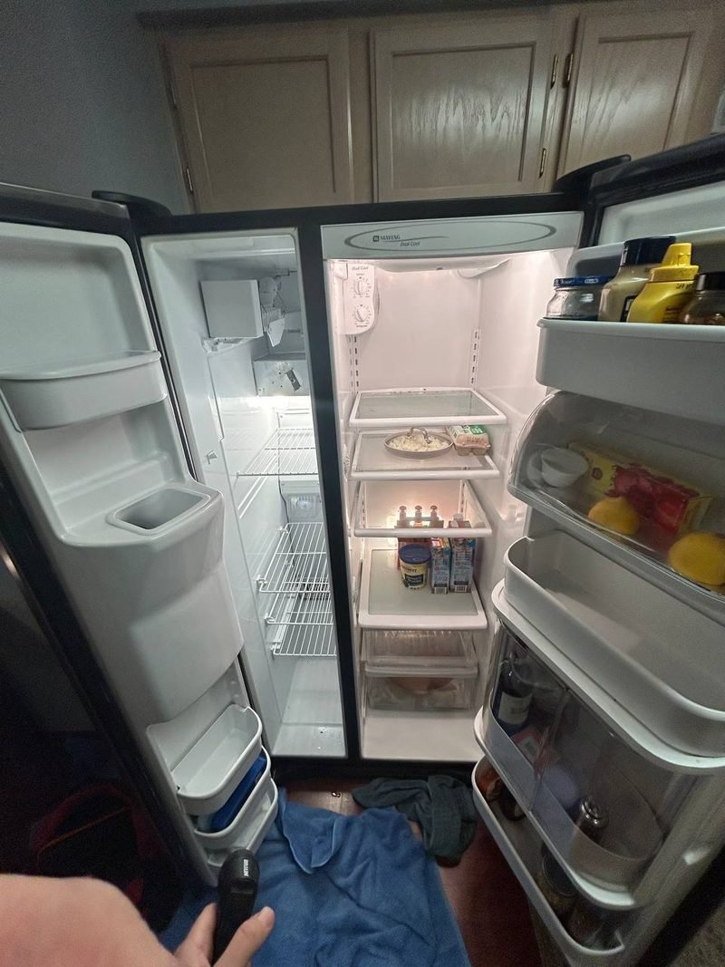 Refrigerator doors open while we check temperatures